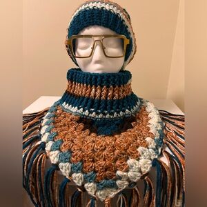 Made by me…multi-colored beanie w/matching fringed neck warmer.